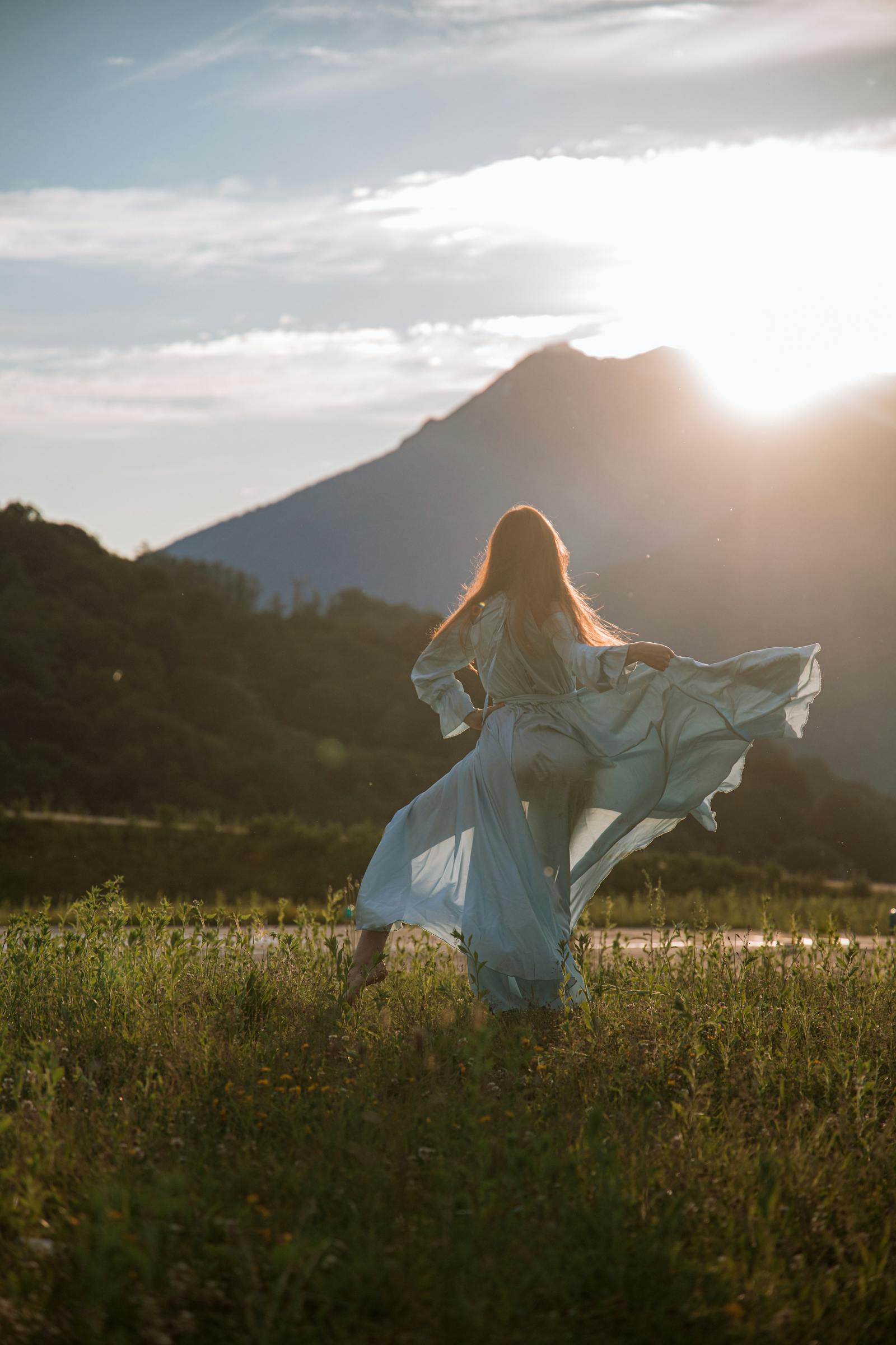 Woman walking in flowing dress